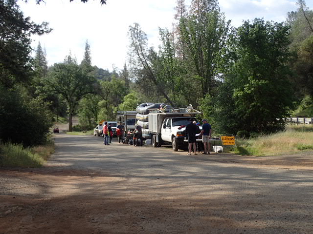 Staging area at launch site. There are a number of different rafting businesses that take turns launching.