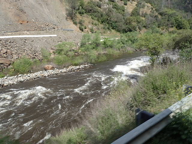 Merced River on left driving towards Yosemite National Park.